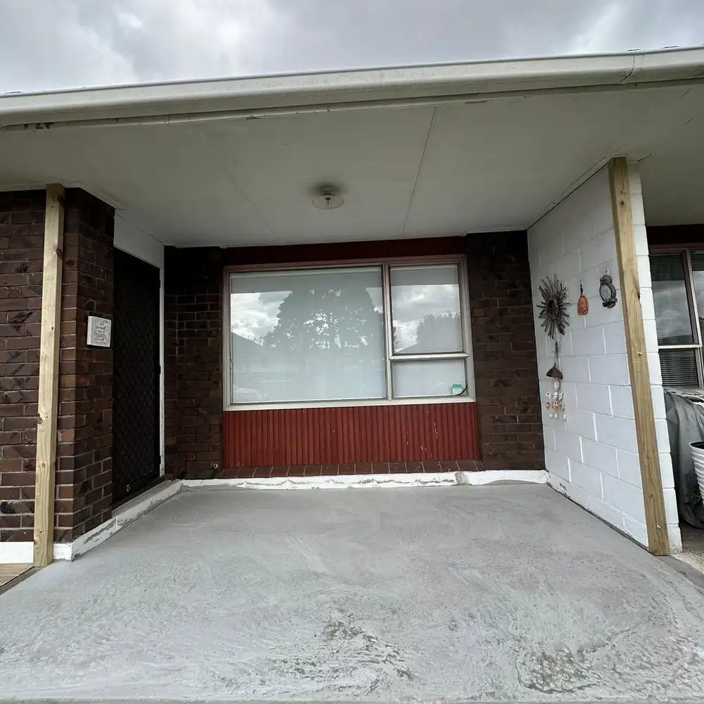 The front entrance patio, raised with new concrete, before the conservatory frame went up.